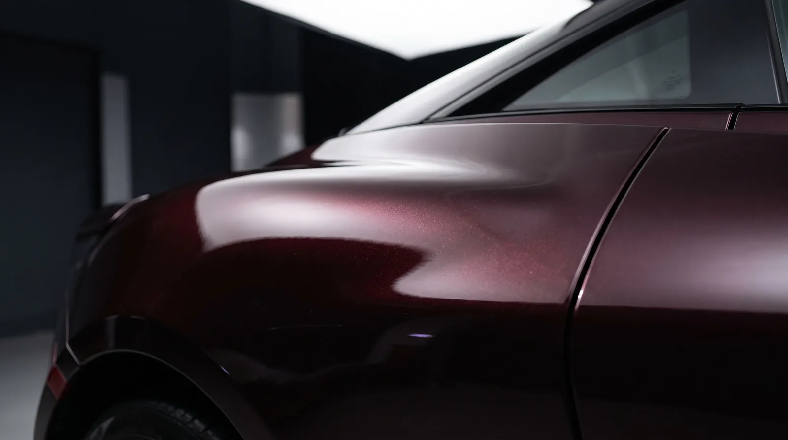 Close-up of a Black Cherry Pearl car paint finish